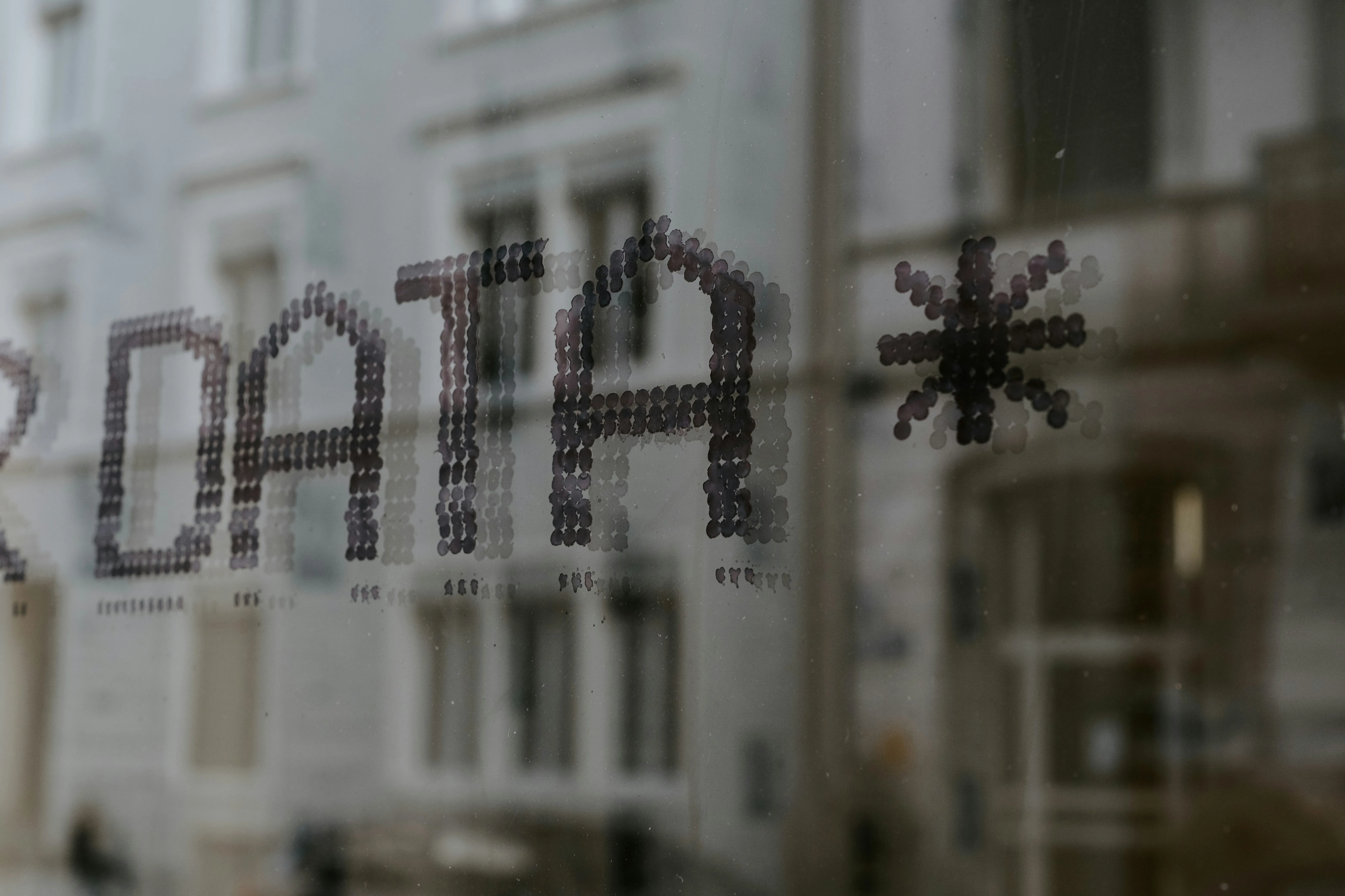 A close up of a window with a building in the background photo – Free Data Image on Unsplash